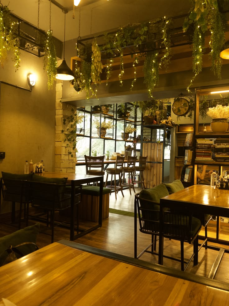 Pepper Leaf Café interior with plants and warm lights